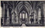 Innenaufnahme der kath. Pfarrkirche St. Michael mit der 1959 entfernten holzgeschnitzten Kanzel, im spätgotischen Stil in der Bildmitte der Hochaltar als Flügelaltar.